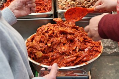 Midsection of person preparing food