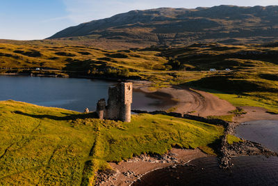 View of the ruined ardvreck castle over loch assynt, sutherland, north west highlands, scotland