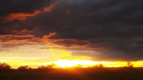 Scenic view of dramatic sky during sunset