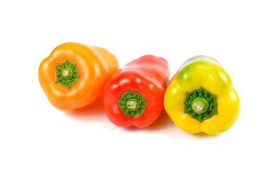 Close-up of bell peppers against white background