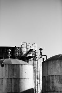 Man against built structure against clear sky