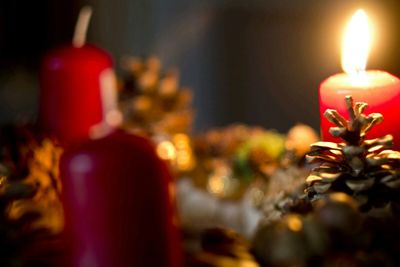 Close-up of candle in dark room