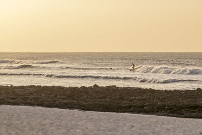 Scenic view of sea against clear sky