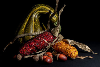 Close-up of strawberries on table against black background