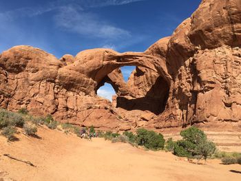 Rock formations on landscape against sky