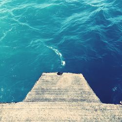 High angle view of staircase by sea