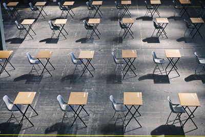 High angle view of empty chairs and table in cafe