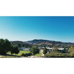 Scenic view of mountains against clear blue sky