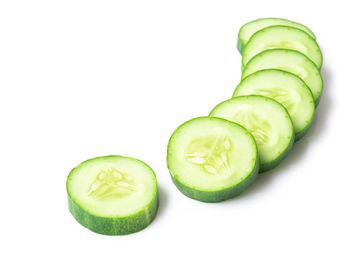 Close-up of green lemon against white background