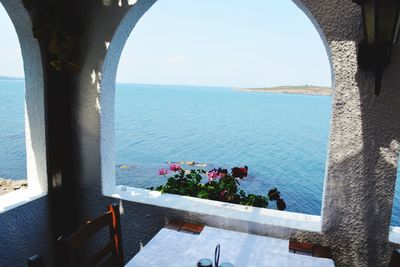 Scenic view of sea seen through window