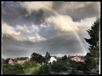Low angle view of building against cloudy sky
