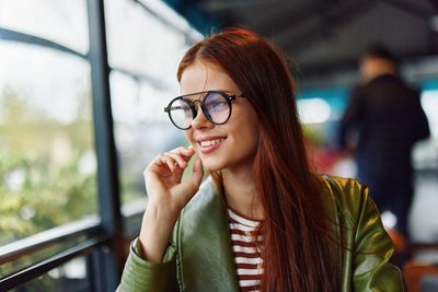 Portrait of young woman looking away