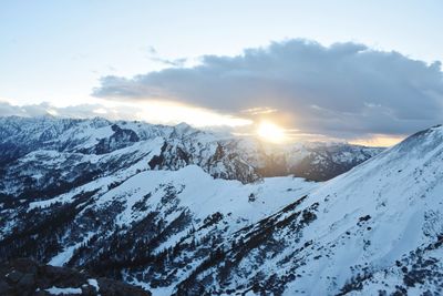 Scenic view of snow covered mountains against sky