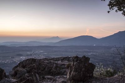 Scenic view of mountains against sky during sunset