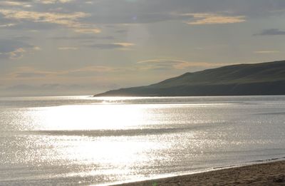 View of calm beach against the sky