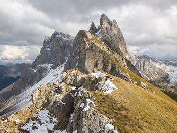 Seceda ridge in autumn with early snow in dolomites italy