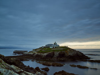 View of the lighthouse of tapia island, tapia de casariego, spain