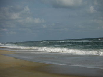 Scenic view of beach and sea against sky