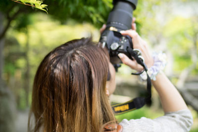 Woman photographing through camera