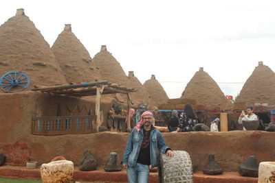 Front view of man standing on rock formations