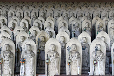 Statues in temple outside building