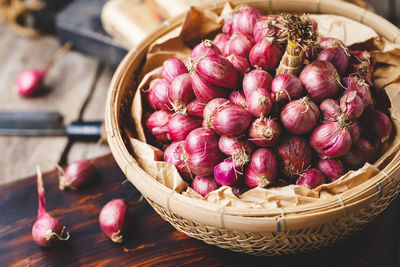 High angle view of strawberries in basket on table