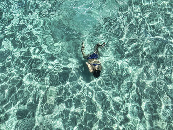 High angle view of person swimming in sea