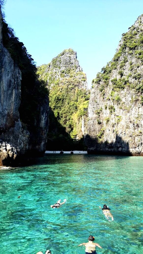 water, rock formation, sea, rock - object, waterfront, beauty in nature, tranquility, scenics, cliff, mountain, blue, clear sky, tranquil scene, nature, rock, day, rippled, rocky mountains, idyllic, outdoors