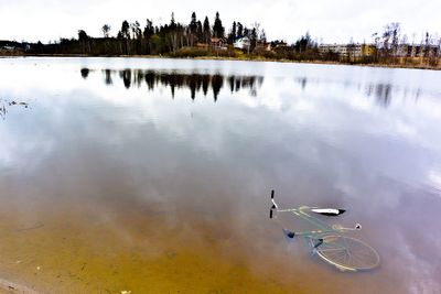 Reflection of clouds in calm lake