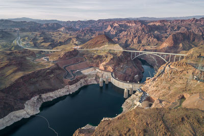 Hoover dam in nevada. mountain and colorado river in background.