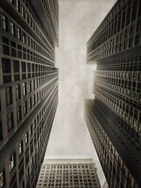 Low angle view of modern buildings against sky