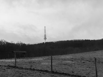 Scenic view of landscape against cloudy sky