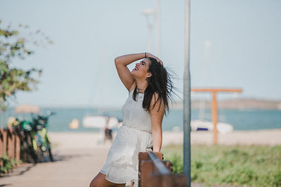 Young woman wearing sunglasses on beach