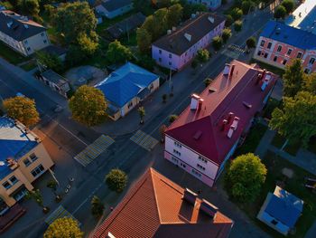 High angle view of houses amidst buildings in town