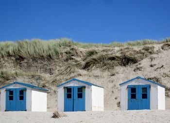 Houses against clear blue sky