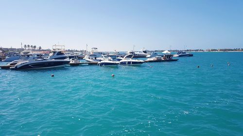 Boats moored in sea