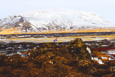 Scenic view of snowcapped mountains against sky