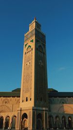 Low angle view of building against clear blue sky