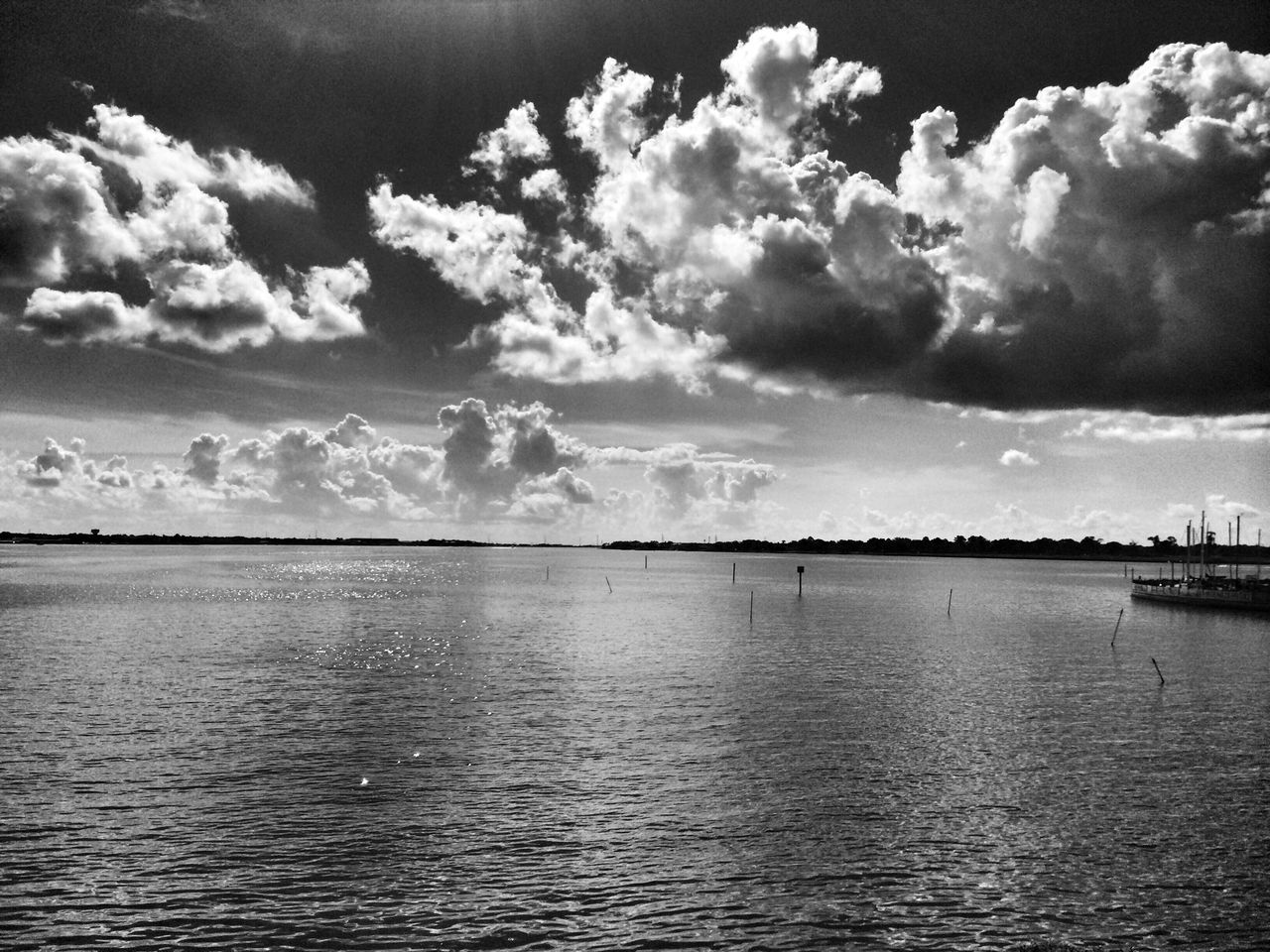 water, waterfront, sky, tranquil scene, sea, tranquility, scenics, cloud - sky, beauty in nature, rippled, cloudy, nature, cloud, idyllic, horizon over water, outdoors, day, calm, no people, seascape