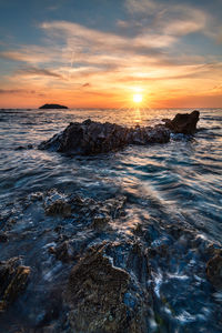 Scenic view of sea against sky during sunset