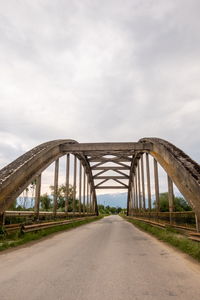 Bridge over road against sky