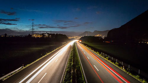 Light trails on road at night