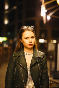 Portrait of young woman standing outdoors