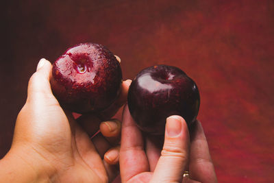 Close-up of hand holding strawberry