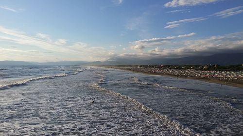 Scenic view of sea against cloudy sky