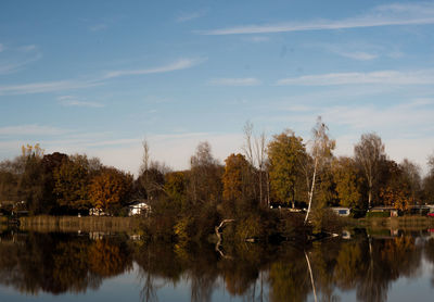 Scenic view of lake against sky during autumn
