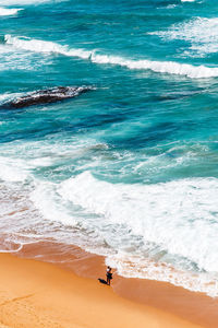 High angle view of man on beach against sky