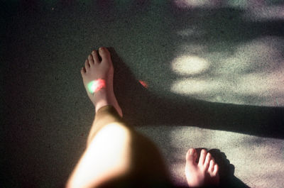 Low section of woman wearing shoes