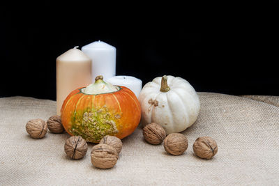 Close-up of pumpkins against black background