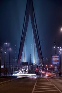 Road leading towards erasmus bridge at night